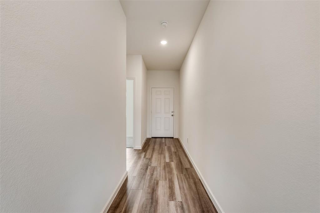 1608 Escondido Drive Haslet, TX 76052 - Photo 5 of 20 a view of a hallway with wooden floor