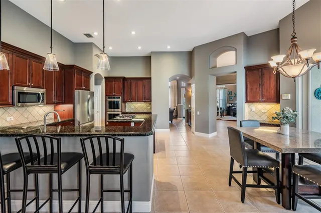 a view of walk in closet with clothes