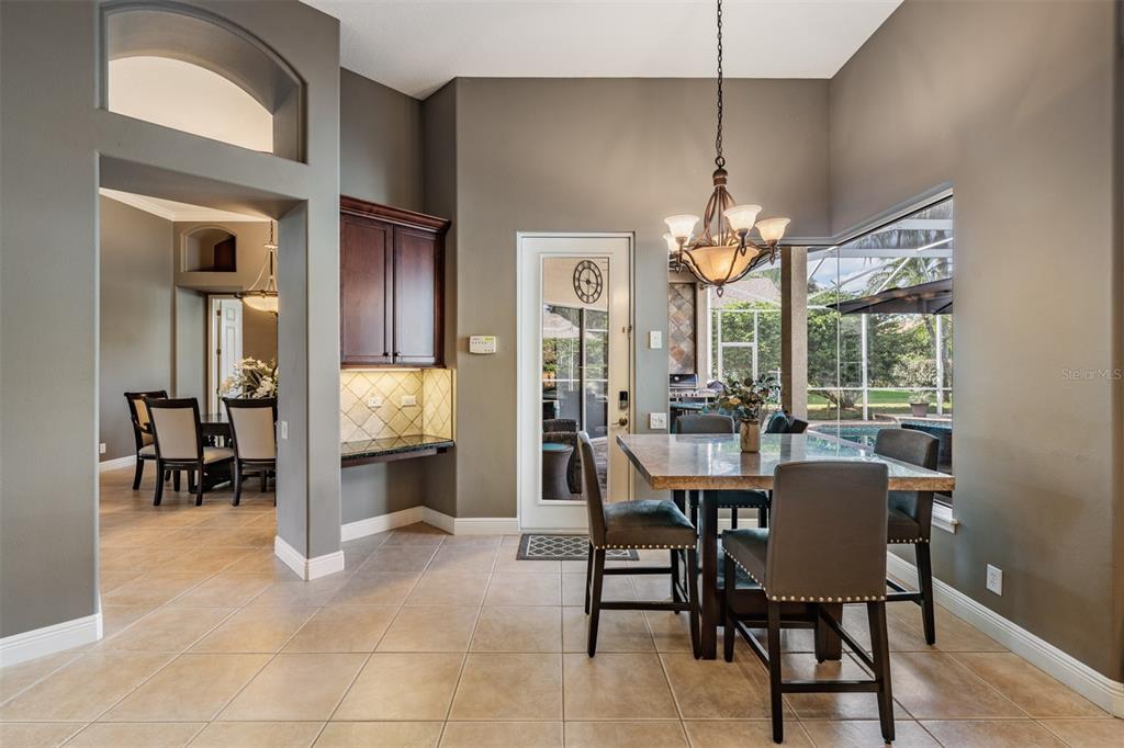 3727 Janus Way Palm Harbor, FL 34685 - Photo 20 of 98 a dining room with furniture and window