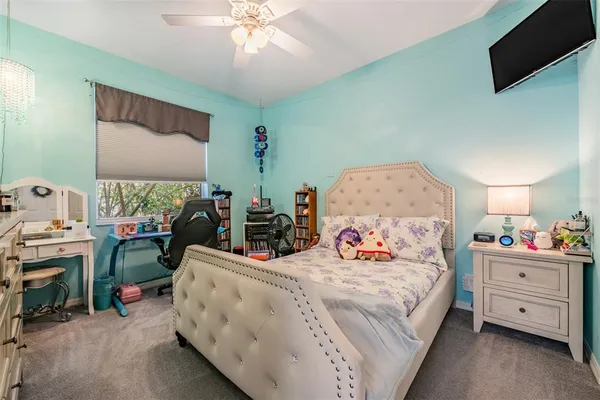 a view of a lake with houses in the back