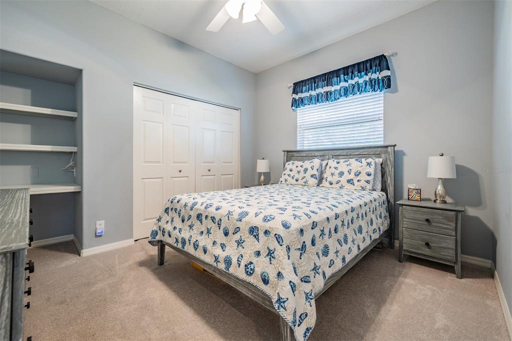3727 Janus Way Palm Harbor, FL 34685 - Photo 33 of 98 a bedroom with a bed and a window