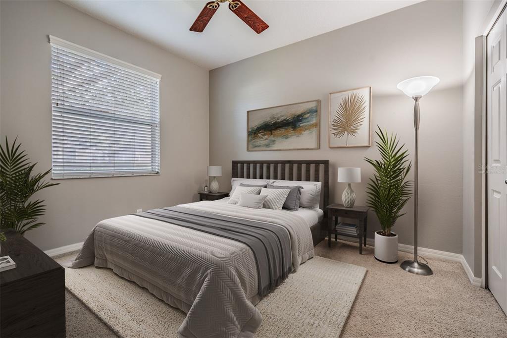 3727 Janus Way Palm Harbor, FL 34685 - Photo 35 of 98 a bedroom with a bed and a potted plant
