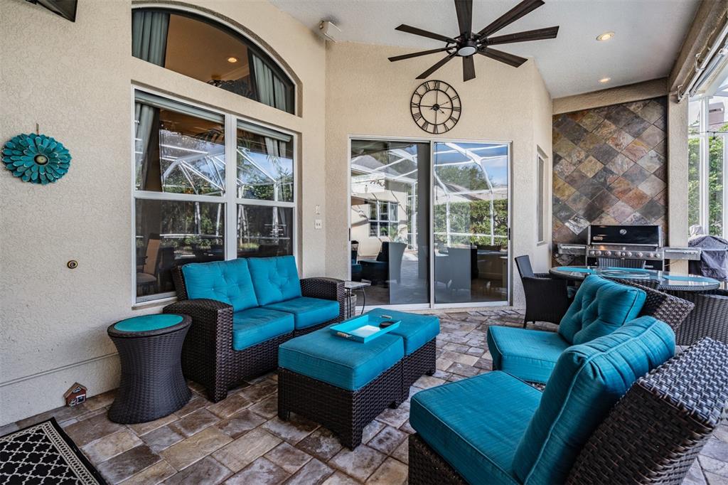 3727 Janus Way Palm Harbor, FL 34685 - Photo 44 of 98 a living room with furniture a chandelier and a window