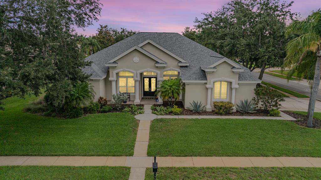 3727 Janus Way Palm Harbor, FL 34685 - Photo 58 of 98 a front view of a house with a yard