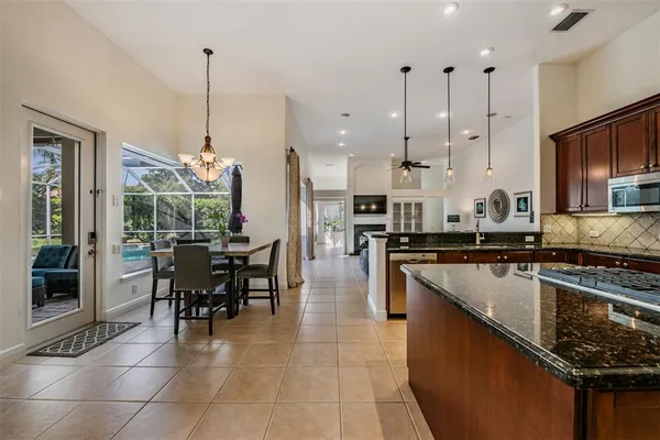 a living room with furniture and a ceiling fan