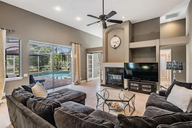 a kitchen with stainless steel appliances granite countertop a sink a stove and a refrigerator