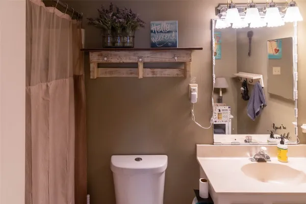 a bathroom with a sink and a toilet