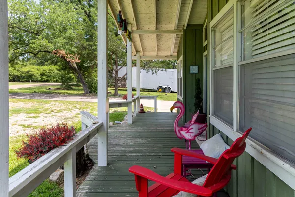 a view of a balcony with chairs