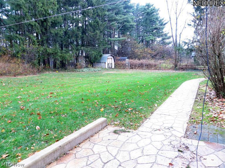 2357 Middleton Road Hudson, OH 44236 - Photo 24 of 25 Backyard Stamed Concrete Patio and Walkway. Beautiful Wooded Lot with plenty of space for BBQ's, Playtime and Entertaining. Shed too. Almost 1 Acre Lot.