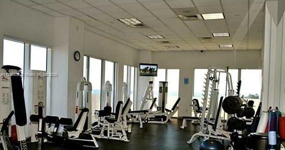 6365 Collins Avenue, Unit 1508 Miami Beach, FL 33141 - Photo 14 of 18 a view of a room with gym equipment
