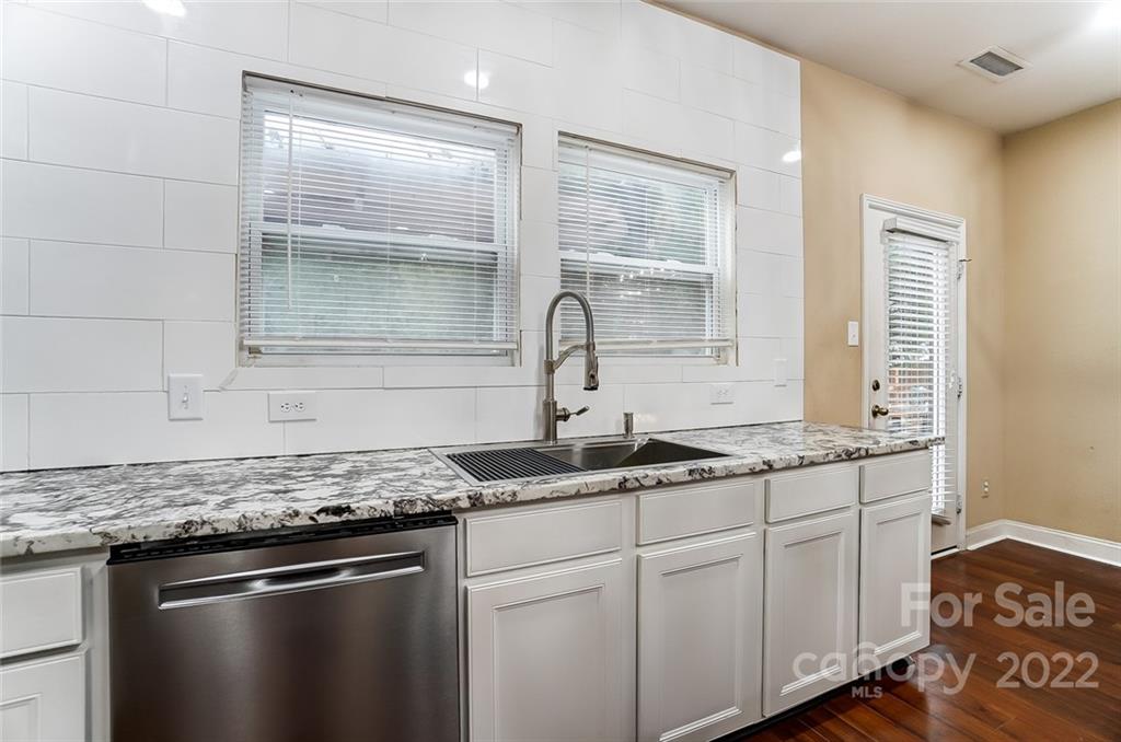 207 Old Carriage Road Clover, SC 29710 - Photo 12 of 48 a kitchen with stainless steel appliances granite countertop a sink and a granite counter tops