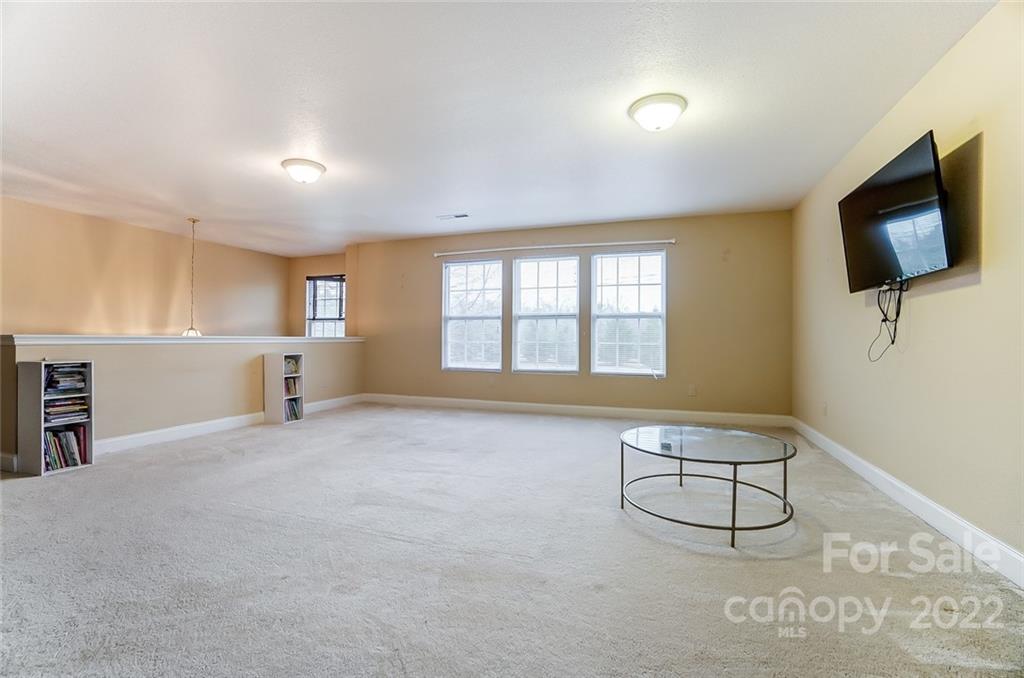207 Old Carriage Road Clover, SC 29710 - Photo 23 of 48 a view of an empty room with a window and a kitchen