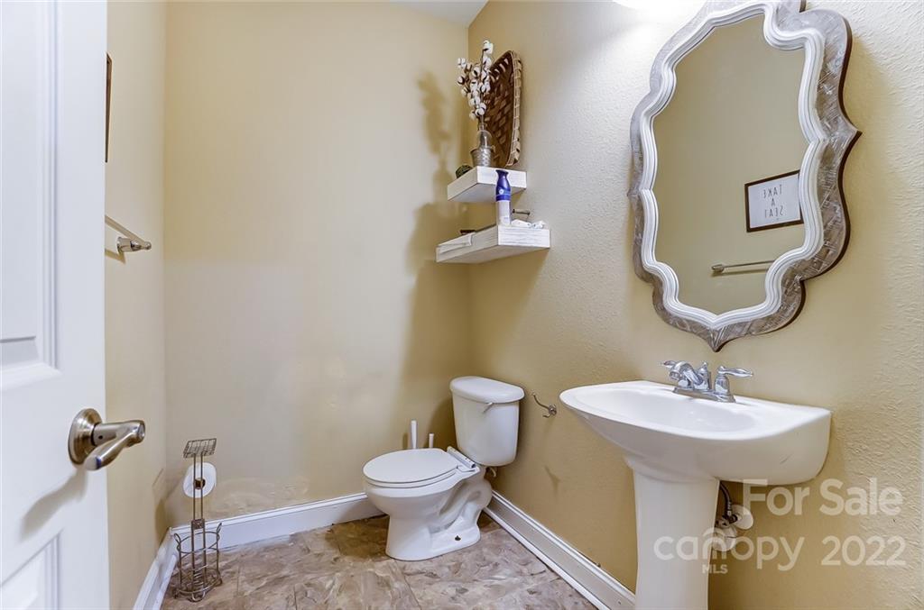 207 Old Carriage Road Clover, SC 29710 - Photo 26 of 48 a bathroom with a toilet sink and mirror
