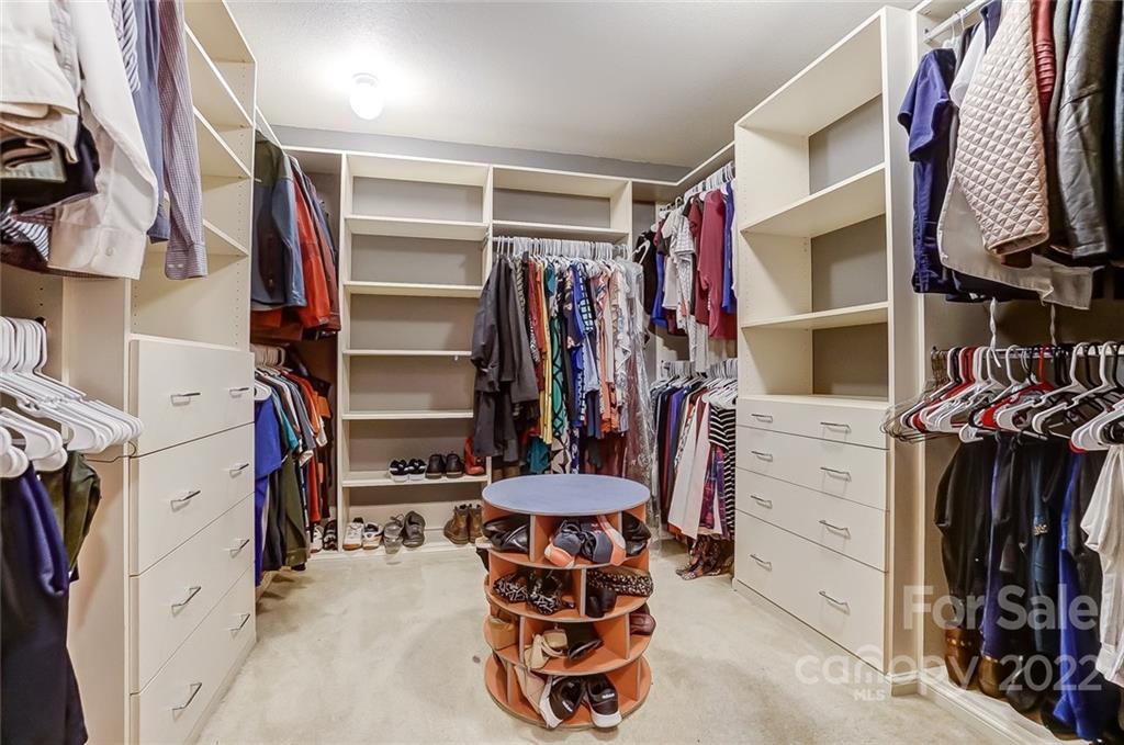 207 Old Carriage Road Clover, SC 29710 - Photo 31 of 48 a view of walk in closet with clothes and shoes