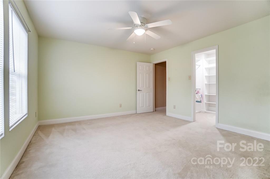 207 Old Carriage Road Clover, SC 29710 - Photo 38 of 48 an empty room with a ceiling fan and a window