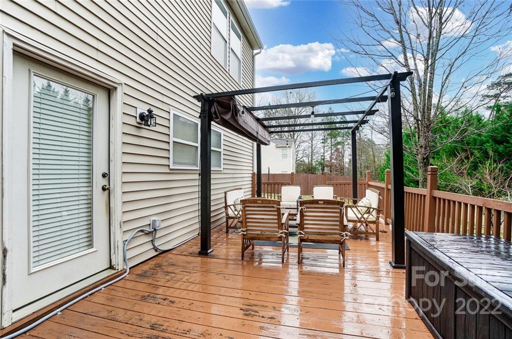 207 Old Carriage Road Clover, SC 29710 - Photo 42 of 48 a balcony with furniture and wooden floor