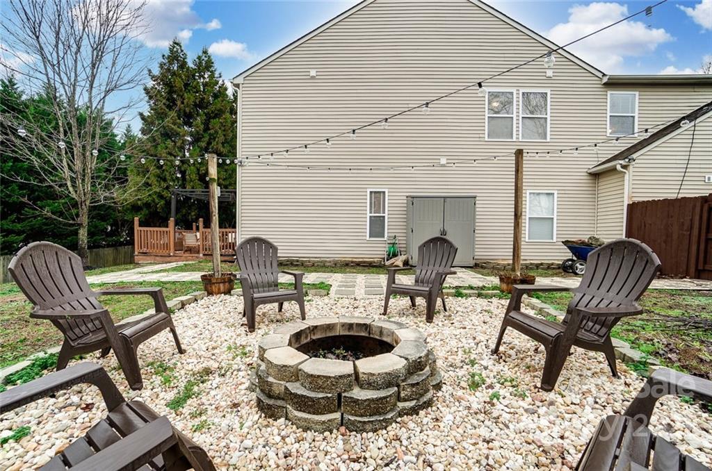 207 Old Carriage Road Clover, SC 29710 - Photo 44 of 48 a outdoor living space with furniture and a fireplace