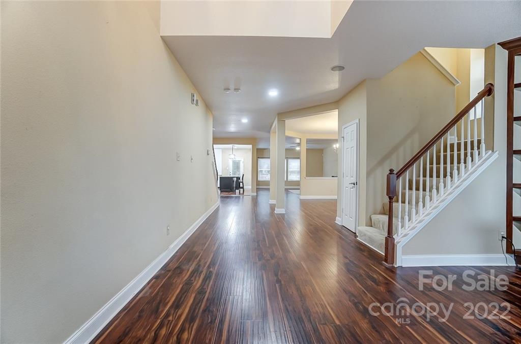 207 Old Carriage Road Clover, SC 29710 - Photo 5 of 48 a view of a hallway view with wooden floor and staircase