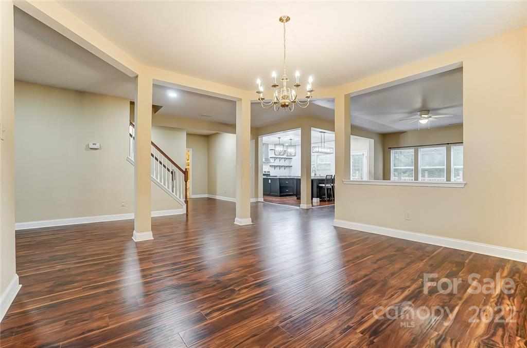 207 Old Carriage Road Clover, SC 29710 - Photo 7 of 48 a view of a room with wooden floor and chandelier