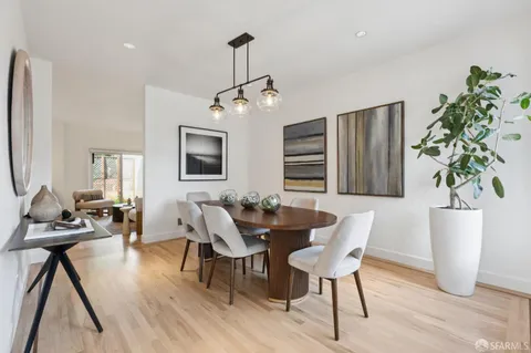 a kitchen with a table and chairs in it