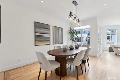 a bathroom with a toilet a sink and a mirror