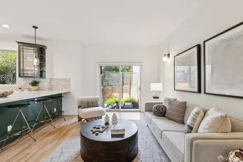 a bedroom with a large bed and a couch