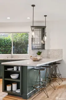 a bedroom with a large bed and a potted plant