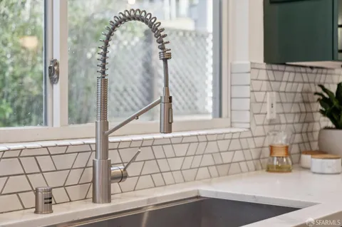 a balcony with wooden fence and trees