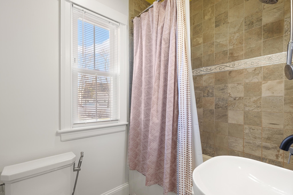 222 Lawrence Street Haverhill, MA 01830 - Photo 14 of 32 a bathroom with a toilet and shower