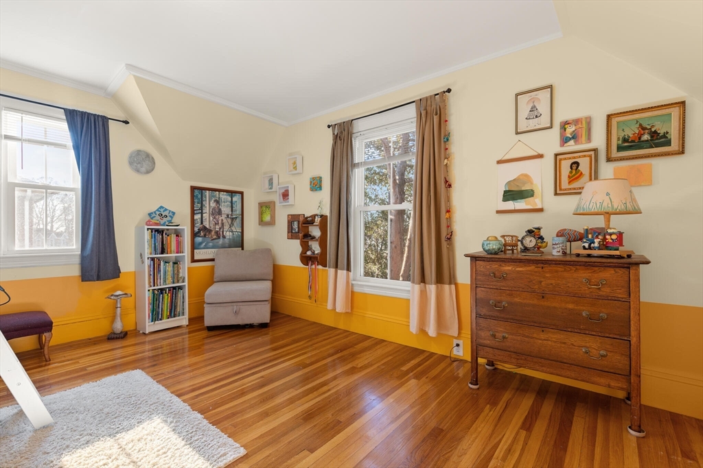 222 Lawrence Street Haverhill, MA 01830 - Photo 19 of 32 a bedroom with furniture and wooden floor