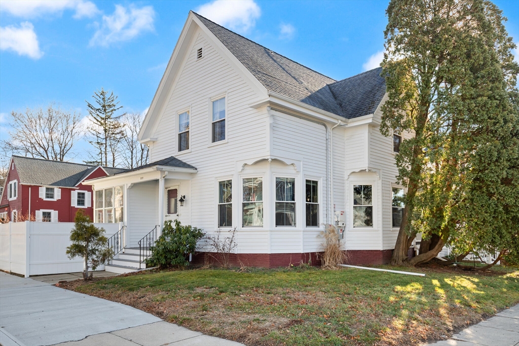 222 Lawrence Street Haverhill, MA 01830 - Photo 2 of 32 a front view of a house with a yard and garage