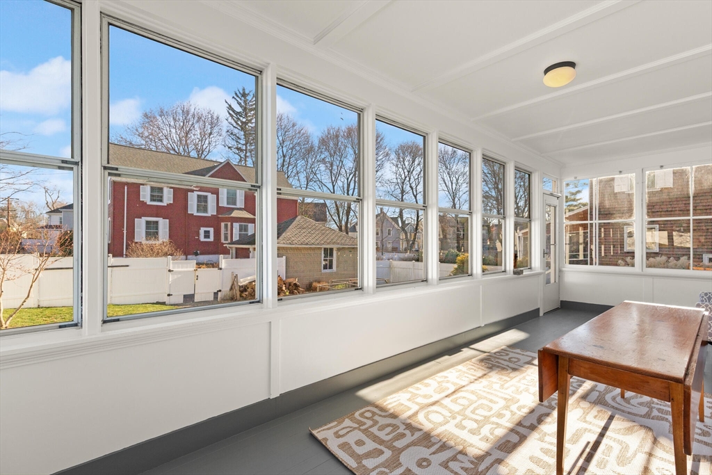 222 Lawrence Street Haverhill, MA 01830 - Photo 25 of 32 a living room with a large window and a table