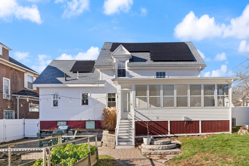 222 Lawrence Street Haverhill, MA 01830 - Photo 28 of 32 a front view of a house with a garden and yard