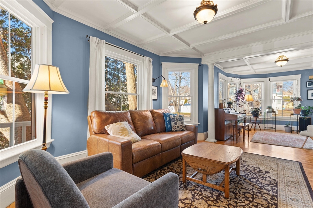 222 Lawrence Street Haverhill, MA 01830 - Photo 3 of 32 a living room with furniture and a lamp