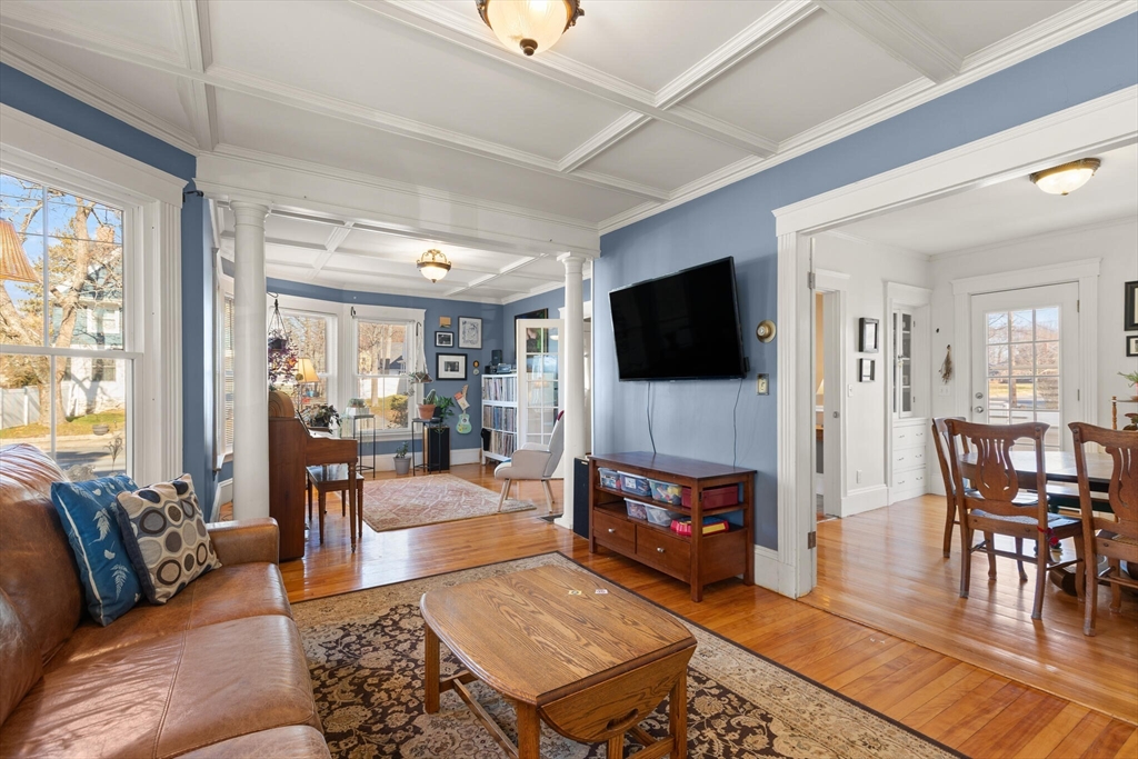 222 Lawrence Street Haverhill, MA 01830 - Photo 4 of 32 a living room with furniture and a flat screen tv