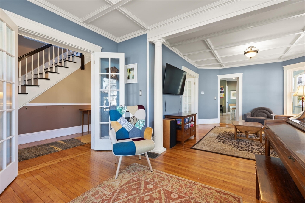 222 Lawrence Street Haverhill, MA 01830 - Photo 7 of 32 a living room with furniture fireplace and dining table