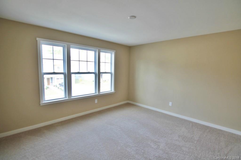 2186 Bluebell Way, Unit 170 Tega Cay, SC 29708 - Photo 14 of 15 an empty room with a empty space and windows