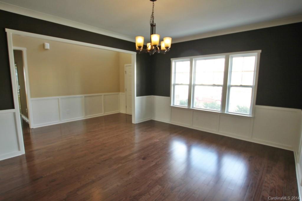2186 Bluebell Way, Unit 170 Tega Cay, SC 29708 - Photo 3 of 15 a view of an empty room with wooden floor and a window