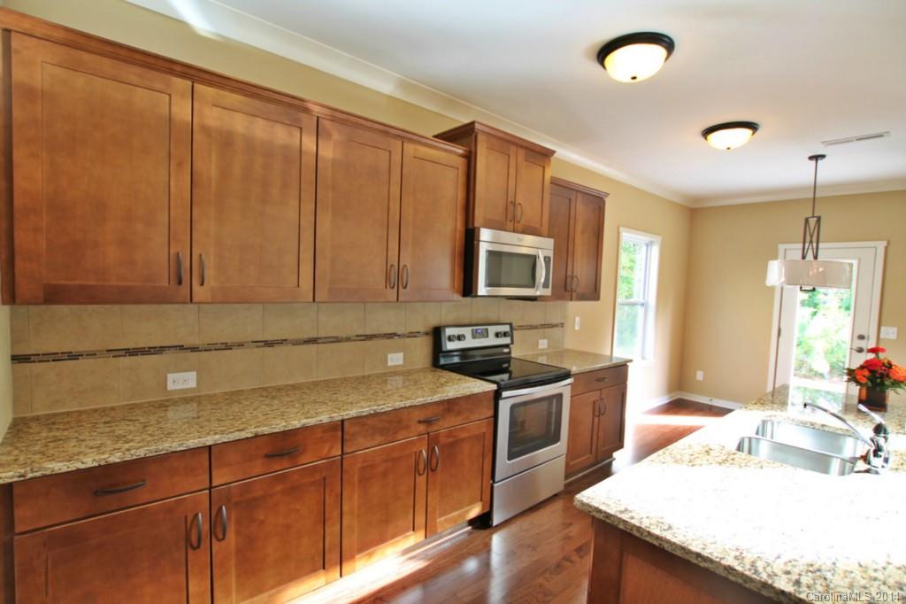 2186 Bluebell Way, Unit 170 Tega Cay, SC 29708 - Photo 5 of 15 a kitchen with a sink and cabinets