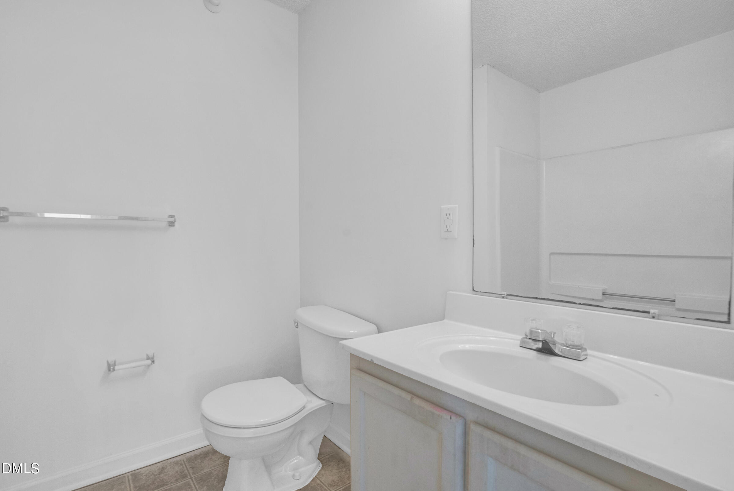 1911 Wolf Tech Lane, Unit 302 Raleigh, NC 27603 - Photo 19 of 20 a bathroom with a sink and a toilet