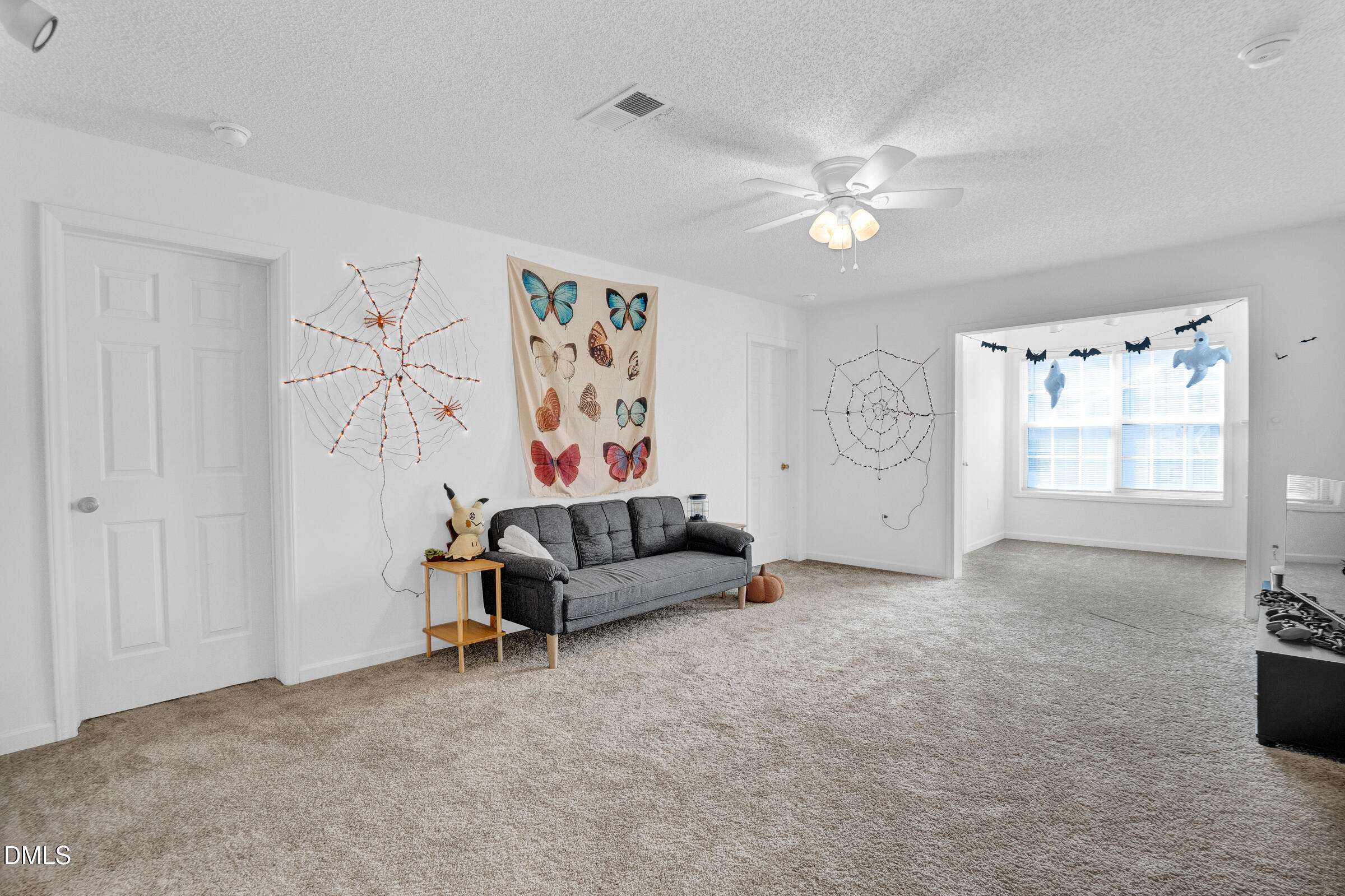 1911 Wolf Tech Lane, Unit 302 Raleigh, NC 27603 - Photo 6 of 20 a living room with furniture and a ceiling fan