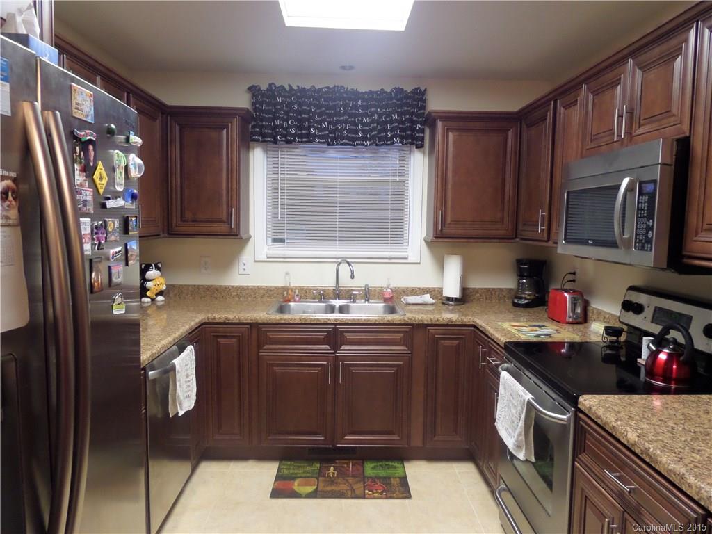 161 Quail Ridge Lane Fort Mill, SC 29708 - Photo 3 of 24 a kitchen with stainless steel appliances granite countertop a sink stove and refrigerator