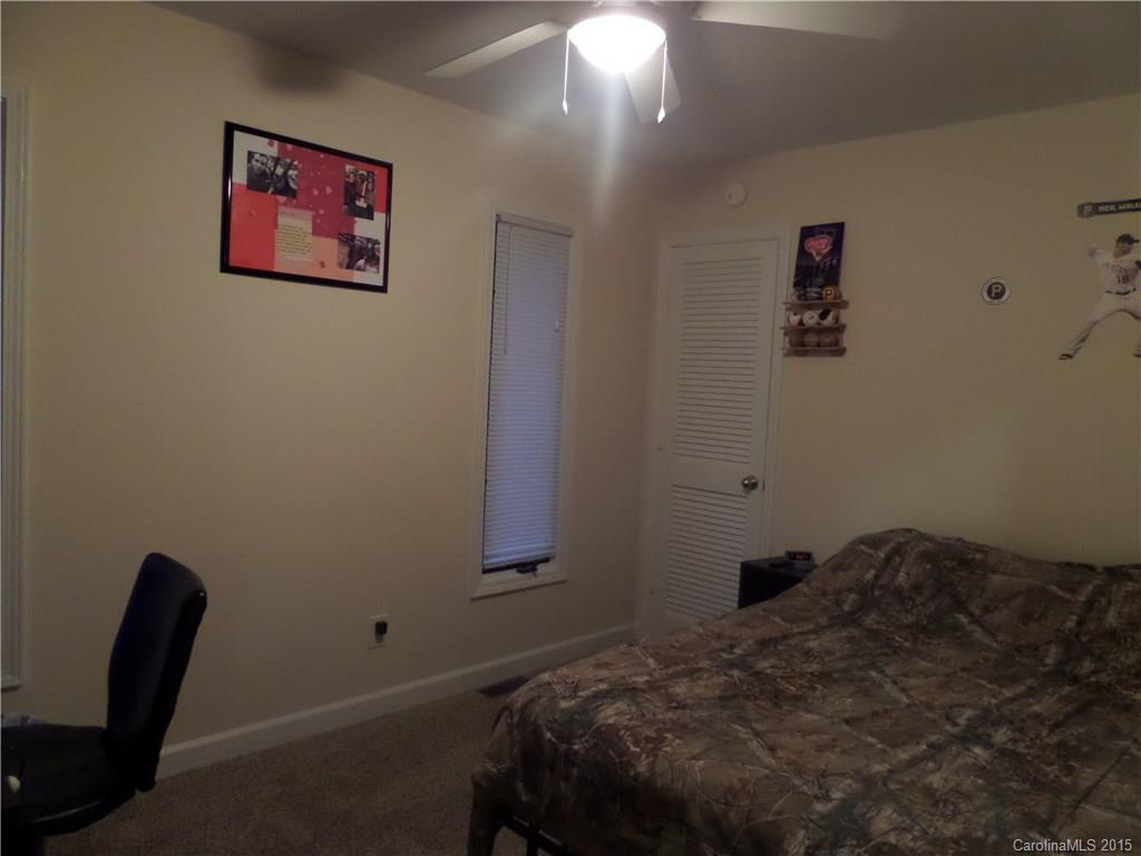 161 Quail Ridge Lane Fort Mill, SC 29708 - Photo 8 of 24 a bedroom with a bed and a chair