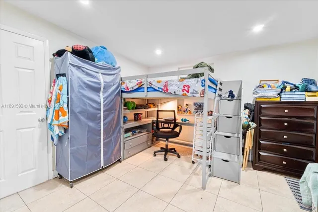 a view of a room with workspace and a couch