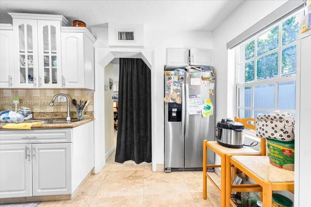 a bedroom with a bed and a table in it