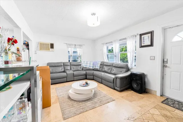 a living room with furniture and a window