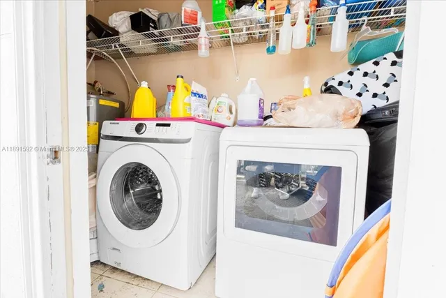 a utility room with dryer and washer
