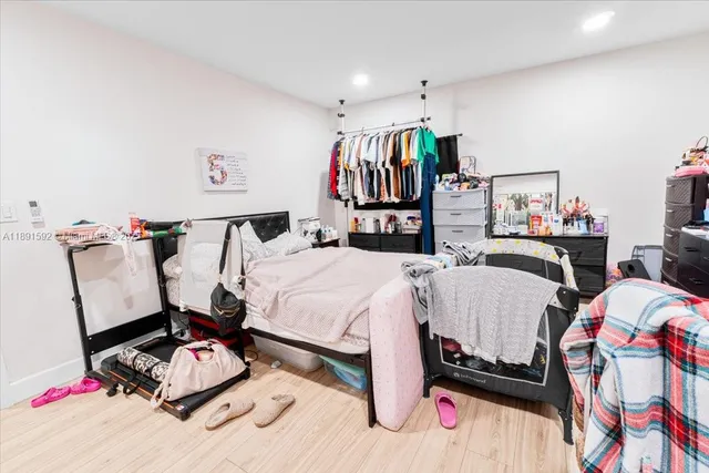 a bedroom with a bed and dresser