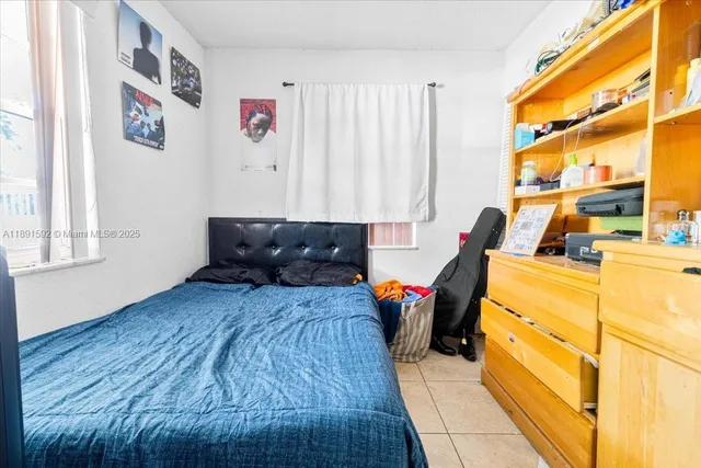 a bed room with a bed and a couch