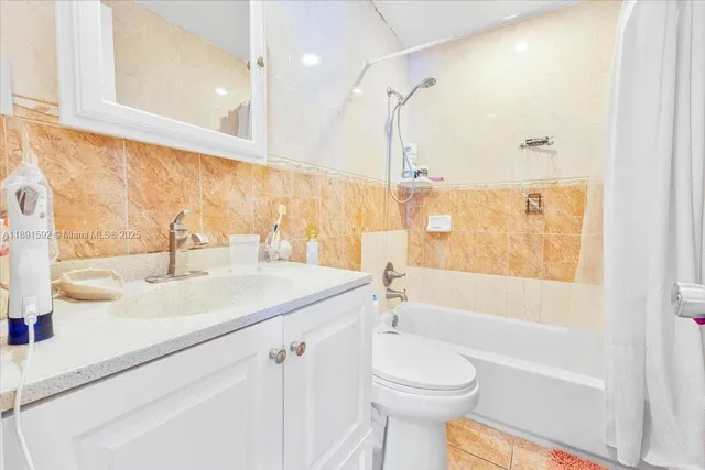 a bathroom with a sink a toilet and a bathtub